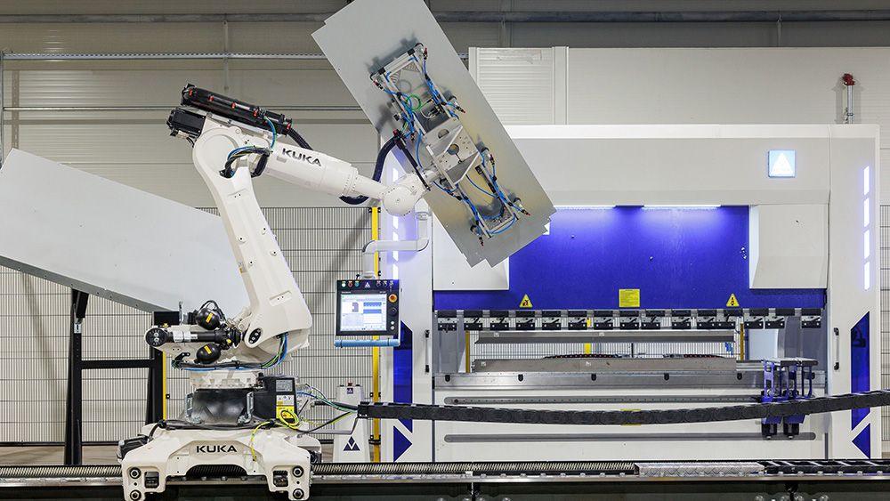 Industrial robot working on a parcel locker inside a parcel locker company